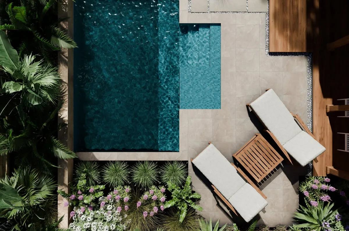 Aerial view of luxury swimming pool design and garden landscaping with modern beach house architecture and tropical palms
